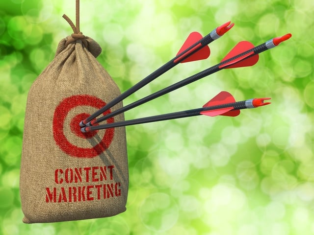 Content Marketing - Three Arrows Hit in Red Target on a Hanging Sack on Natural Bokeh Background..jpeg